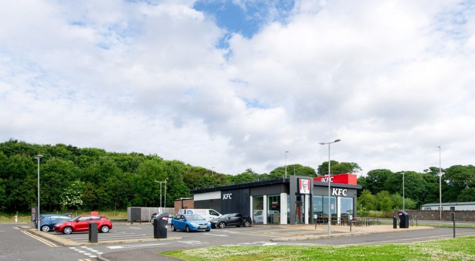 Exterior view of the KFC drive-through at Westway Retail Park in Arbroath, recently acquired by SRA Ventures